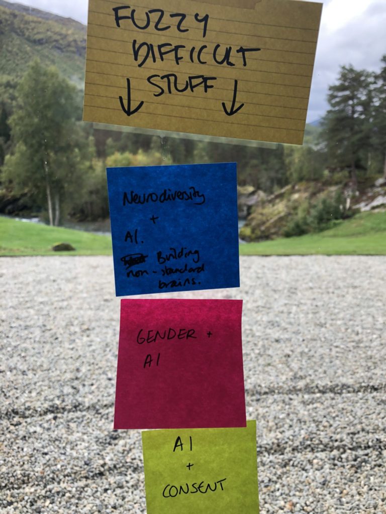 Four post-its detailing "fuzzy difficult stuff" facing AI futurists